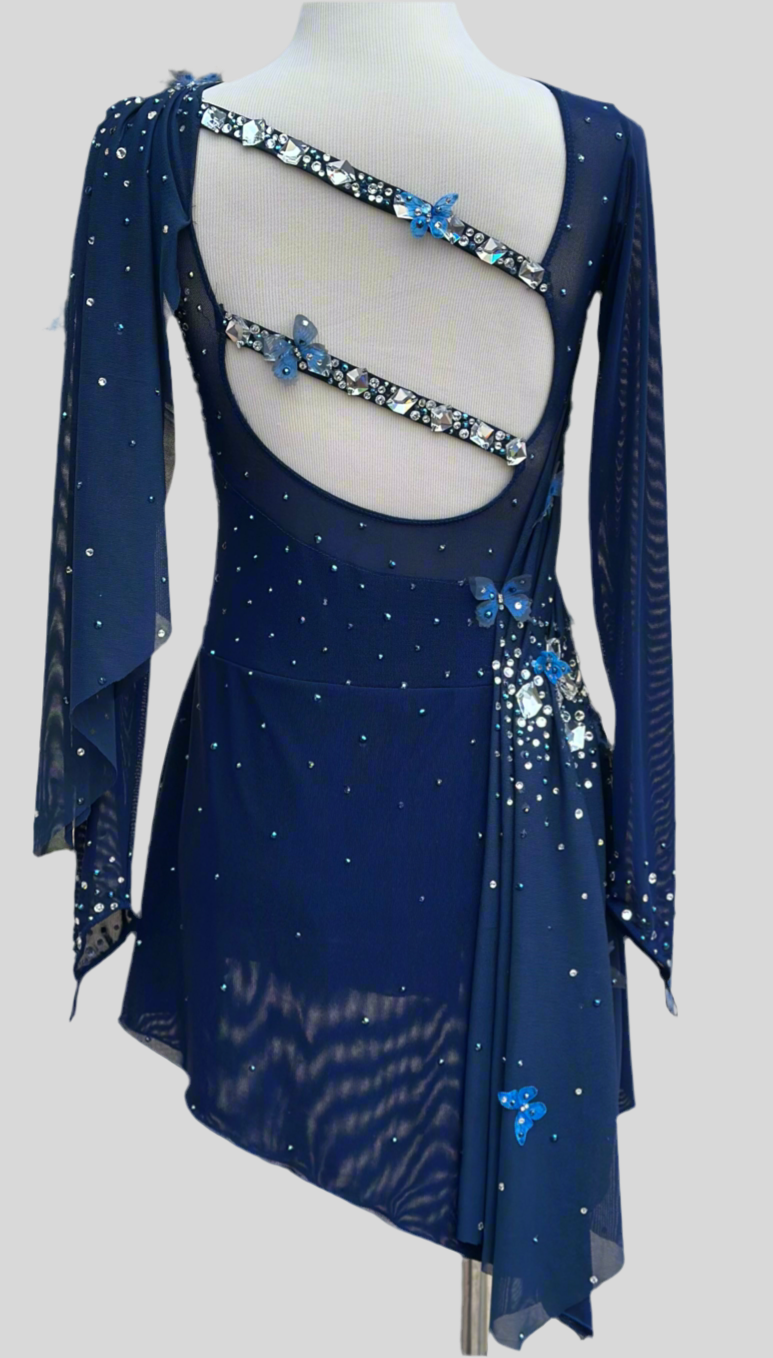 Elegant butterfly figure skating dress in deep blue with crystals, dra Errian Design Icewear Elegant butterfly figure skating dress in deep blue with crystals, dra Errian Design Icewear